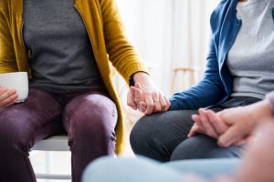 Holding hands in a healing session